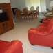 spacious livingroom with leather furniture